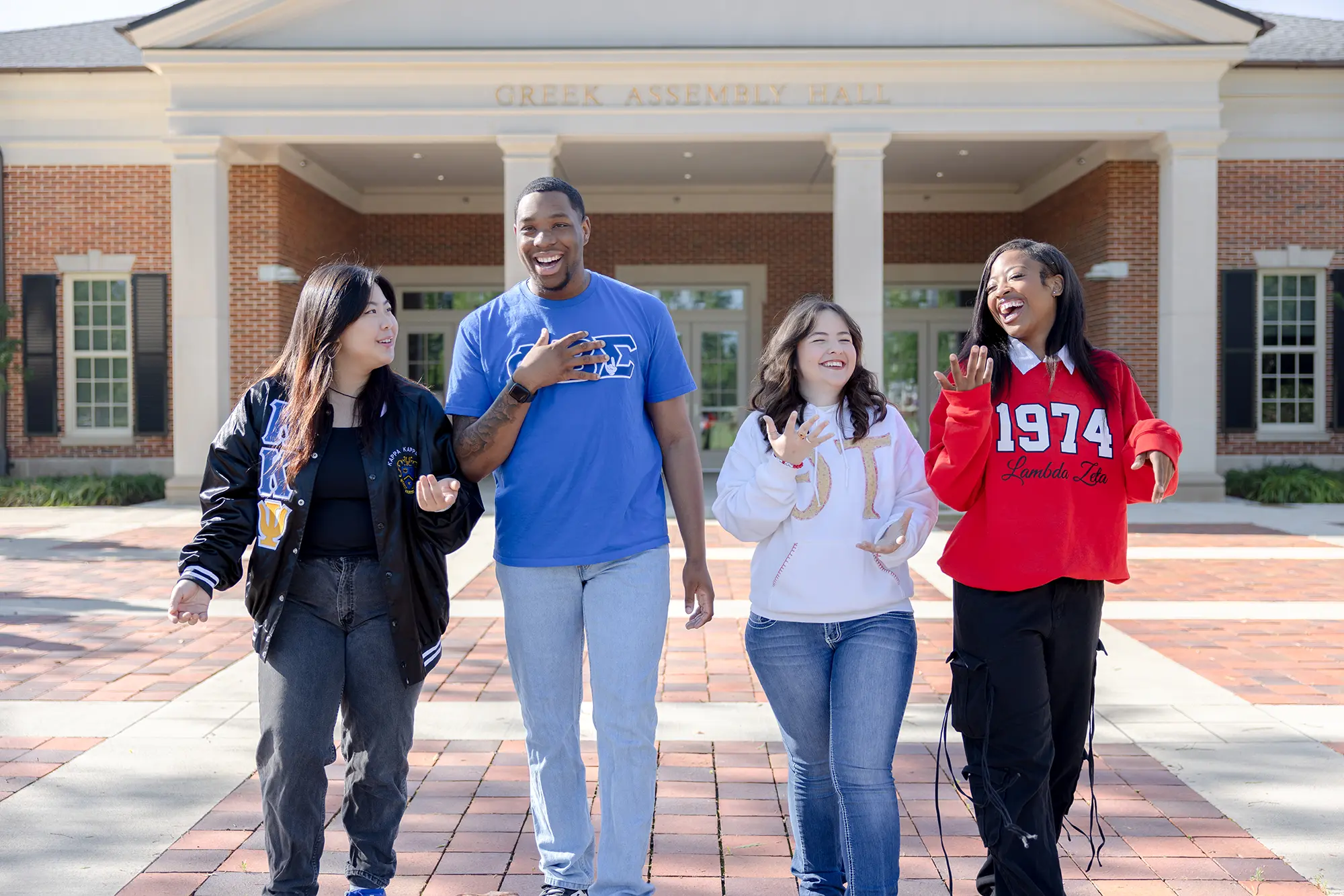 Alabama National Pan-Hellenic Council and United Greek Council members standing in front of the Greek Assembly Hall